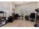 Bright home office with a dual workstation, neutral walls, and tile flooring at 20409 W Thayer St, Buckeye, AZ 85396
