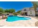 Luxury backyard pool and patio with seating and outdoor cooking, plus desert landscaping at 20409 W Thayer St, Buckeye, AZ 85396