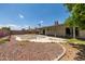 A backyard with a pool, patio, and desert landscaping, ideal for outdoor living at 2119 E Sesame St, Tempe, AZ 85283