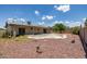 Backyard featuring a pool with steps, complemented by low-maintenance desert landscaping at 2119 E Sesame St, Tempe, AZ 85283