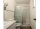 This bathroom has a shower with sliding doors, a vanity with a sink, and a window for natural light at 2119 E Sesame St, Tempe, AZ 85283
