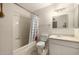 Bathroom with shower and bath includes a tile floor, white walls, a sink and standard size toilet at 2119 E Sesame St, Tempe, AZ 85283