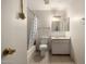 Bathroom with shower and bath includes a tile floor, white walls, a sink and standard size toilet at 2119 E Sesame St, Tempe, AZ 85283