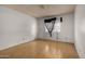 Bedroom featuring hardwood floors, neutral walls and a window with stylish sheer black curtains at 2119 E Sesame St, Tempe, AZ 85283