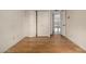 Bedroom includes hardwood floors, white walls, and a closet and has access to the adjacent room at 2119 E Sesame St, Tempe, AZ 85283