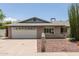 Charming single-story brick home with a two-car garage, and xeriscaping at 2119 E Sesame St, Tempe, AZ 85283