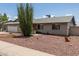 Single-story brick home featuring xeriscaping and a charming ocotillo in the front yard at 2119 E Sesame St, Tempe, AZ 85283
