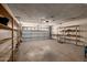 Spacious garage with room for storage and parking; garage door and shelving visible at 2119 E Sesame St, Tempe, AZ 85283
