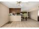 An open kitchen with a breakfast bar, tile floors, and wood cabinets, ready for your personal touch at 2119 E Sesame St, Tempe, AZ 85283