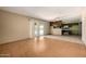 A spacious area blending living and kitchen spaces, featuring sliding glass doors to the backyard at 2119 E Sesame St, Tempe, AZ 85283