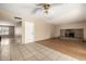 A living room featuring tile and laminate flooring, a fireplace, and a white front door at 2119 E Sesame St, Tempe, AZ 85283