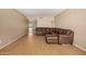 Spacious living room featuring hardwood floors and a comfortable, oversized leather sofa at 2119 E Sesame St, Tempe, AZ 85283