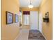 Inviting entryway with neutral walls, tiled floor, and charming decor creates a warm welcome at 2124 W Harwell Rd, Phoenix, AZ 85041