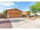 Single-Gathering home featuring a two-car garage, neutral color palette, and well-maintained landscaping at 2124 W Harwell Rd, Phoenix, AZ 85041