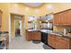 Open kitchen with granite countertops and stainless steel appliances, perfect for cooking and entertaining at 2124 W Harwell Rd, Phoenix, AZ 85041