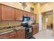 Spacious kitchen with ample cabinets, granite countertops, and modern appliances at 2124 W Harwell Rd, Phoenix, AZ 85041