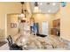 Open kitchen with granite counters, pendant lights, and ample cabinet space for storage at 2124 W Harwell Rd, Phoenix, AZ 85041