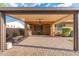 An outdoor covered patio with tile, a ceiling fan, and outdoor seating features a grill for entertaining at 2124 W Harwell Rd, Phoenix, AZ 85041