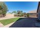 Fenced backyard with gravel, artificial turf and block fence at 22039 N 35Th Dr, Glendale, AZ 85310