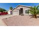 Charming single-story home with a two-car garage and low maintenance desert landscaping at 22039 N 35Th Dr, Glendale, AZ 85310