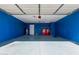 Spacious blue garage featuring side-by-side washer and dryer at 22039 N 35Th Dr, Glendale, AZ 85310