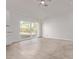 Bright living room area featuring tile floors and sliding glass door to the backyard at 22039 N 35Th Dr, Glendale, AZ 85310