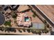 Expansive estate featuring a large pool, tennis court, lush landscaping, and circular driveway at 3126 E Fruitvale Ct, Gilbert, AZ 85297