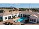 Wide shot of a single-Gathering home with swimming pool, covered patio, and mature landscaping at 3126 E Fruitvale Ct, Gilbert, AZ 85297