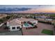 Beautiful home with a pool, tennis court, and well-manicured grounds in a desirable neighborhood at 3126 E Fruitvale Ct, Gilbert, AZ 85297