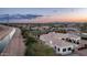 Beautifully landscaped property featuring a tennis court and pool, located near a scenic canal at 3126 E Fruitvale Ct, Gilbert, AZ 85297