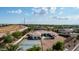 Overhead view showcases the estate with a pool, tennis court, and mature landscaping at 3126 E Fruitvale Ct, Gilbert, AZ 85297