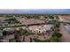 Overhead view of a large home with swimming pool, tennis court, mature desert landscape at 3126 E Fruitvale Ct, Gilbert, AZ 85297