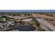 Aerial view of a single-Gathering home, surrounded by lush, mature landscaping and a circular driveway at 3126 E Fruitvale Ct, Gilbert, AZ 85297