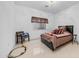 bedroom includes large bed with toy train set on neutral tile floor at 3126 E Fruitvale Ct, Gilbert, AZ 85297