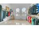 Spacious walk-in closet features custom shelves, ample storage, and dual shuttered windows at 3126 E Fruitvale Ct, Gilbert, AZ 85297