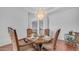 Dining room with chandelier, table set for six, and view to other rooms at 3126 E Fruitvale Ct, Gilbert, AZ 85297