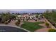 Front exterior of home with circular driveway, mature landscaping, and classic architecture at 3126 E Fruitvale Ct, Gilbert, AZ 85297