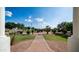 View of the front yard featuring lush landscaping, mature trees, and a brick pathway at 3126 E Fruitvale Ct, Gilbert, AZ 85297
