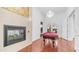 Bright game room with hardwood floors, fireplace, and access to outdoors at 3126 E Fruitvale Ct, Gilbert, AZ 85297