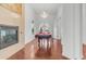 Game room with fireplace, hardwood floors, and access to outside at 3126 E Fruitvale Ct, Gilbert, AZ 85297