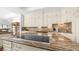 Custom kitchen island features granite countertops, built-in stovetop, ample storage, and custom cabinets for convenience at 3126 E Fruitvale Ct, Gilbert, AZ 85297