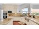 Well-appointed kitchen with granite countertops, tile backsplash, and modern appliances at 3126 E Fruitvale Ct, Gilbert, AZ 85297