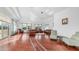 Spacious living room with wood floors, tray ceiling, and plentiful seating at 3126 E Fruitvale Ct, Gilbert, AZ 85297