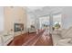 Spacious living room with fireplace, coffered ceilings, columns, and long rug at 3126 E Fruitvale Ct, Gilbert, AZ 85297