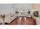 Bright living room with fireplace, hardwood floors, and French doors leading to outdoor area at 3126 E Fruitvale Ct, Gilbert, AZ 85297