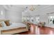 Bright bedroom boasts hardwood floors, tray ceilings, seating area, and plentiful natural light at 3126 E Fruitvale Ct, Gilbert, AZ 85297
