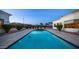 Resort-style pool with a beautiful tiled edge, surrounded by manicured greenery and a serene ambiance at 3126 E Fruitvale Ct, Gilbert, AZ 85297