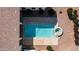 Aerial view of pool and hot tub area surrounded by desert landscaping at 3126 E Fruitvale Ct, Gilbert, AZ 85297