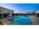 Tranquil backyard featuring a refreshing pool surrounded by lush landscaping, perfect for outdoor relaxation at 3126 E Fruitvale Ct, Gilbert, AZ 85297