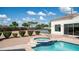 Featuring a pool with attached jacuzzi with steps, and view of backyard landscaping and exterior of the house at 3126 E Fruitvale Ct, Gilbert, AZ 85297